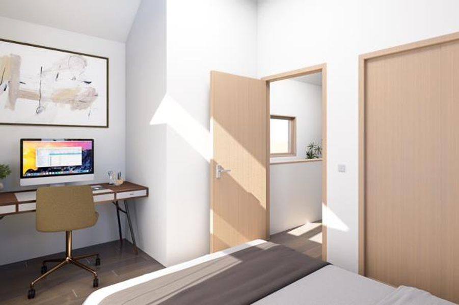 Bright bedroom featuring ample natural light, vaulted ceiling, and built-in workspace with modern finishes, perfect for comfort and productivity.