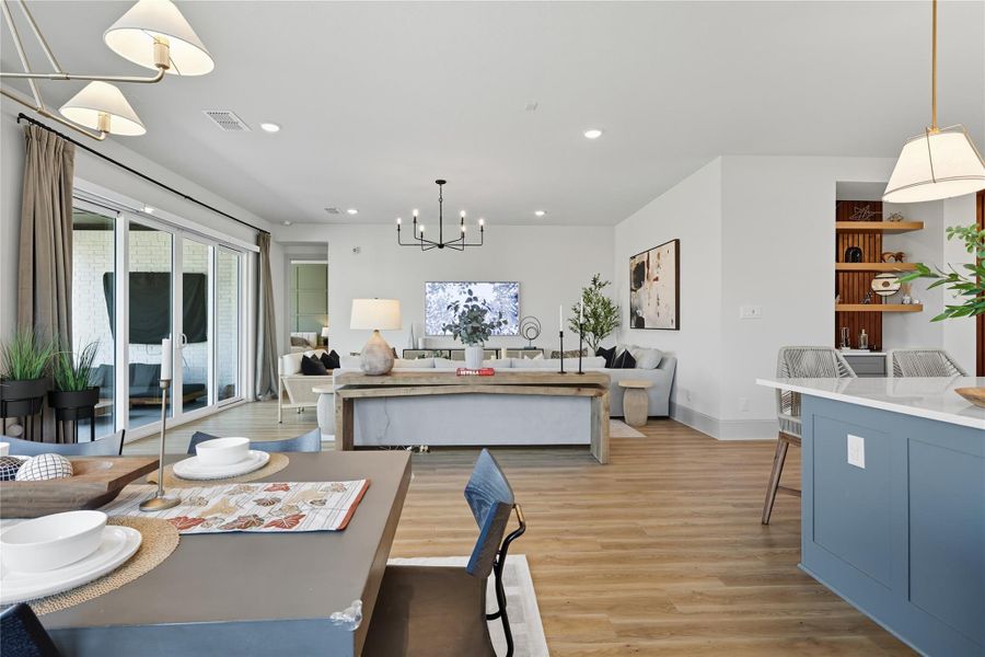 Open floorplan connects kitchen, dining and living areas. Open floorplan connects kitchen, dining and living areas.