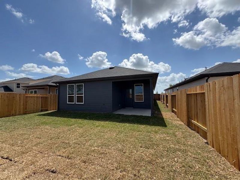 Back yard is a good size, covered patio option added and four sides gutters! Back yard is a good size, covered patio option added and four sides gutters!