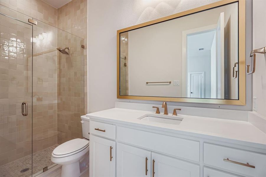 Bathroom featuring vanity and a stall shower