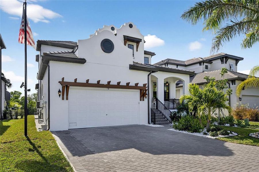 Front exterior of a new home in SouthShore Yacht Club: Somerset Preserve, Ruskin, FL, highlighting curb appeal (Image 2).