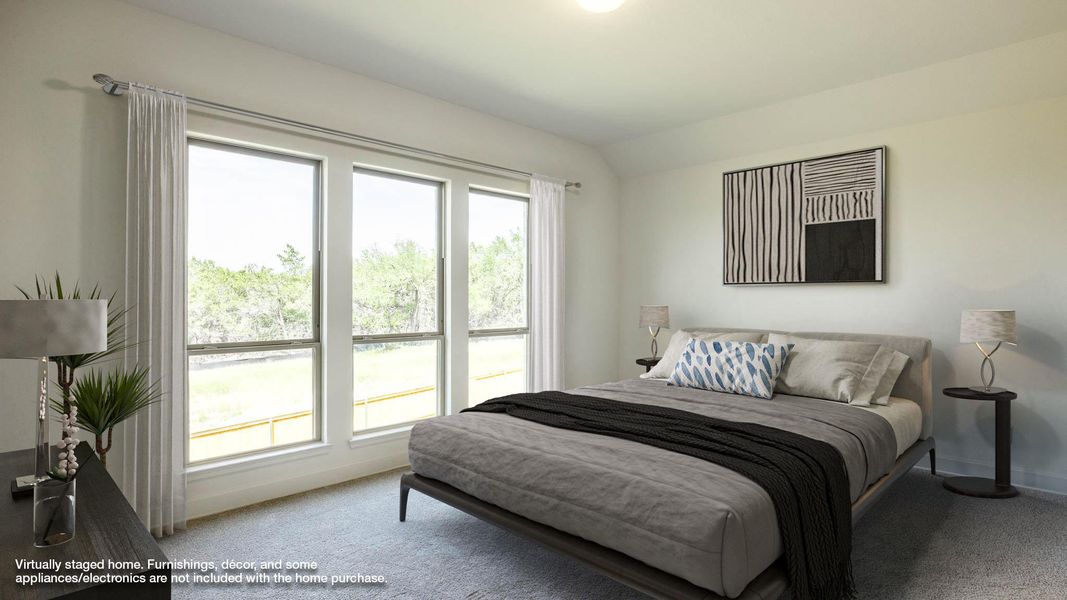 Bedroom with carpet flooring, baseboards, and vaulted ceiling Bedroom with carpet flooring, baseboards, and vaulted ceiling