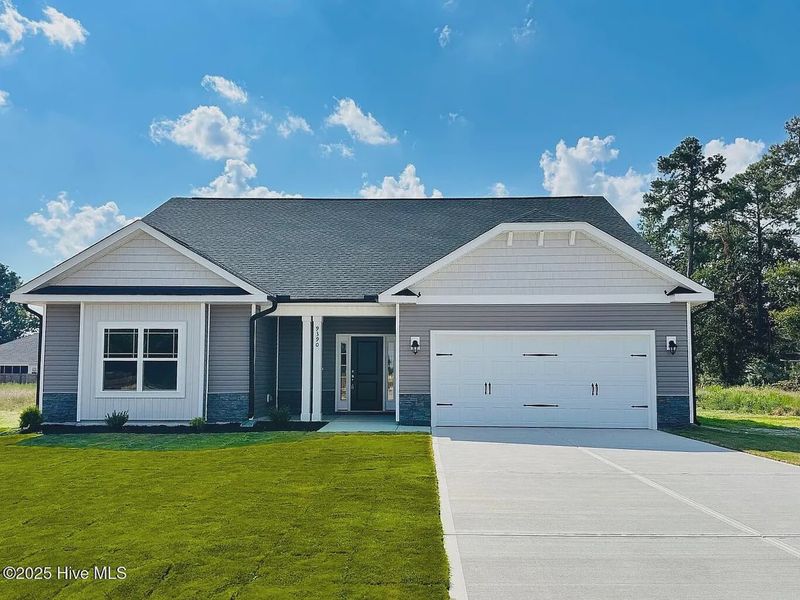 Front exterior of a new home in Cool Water, Bailey, NC, highlighting curb appeal (Image 1).
