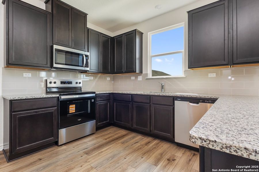 Furnished interior view inside a new home in Woodside Farms, Seguin (Image 4).