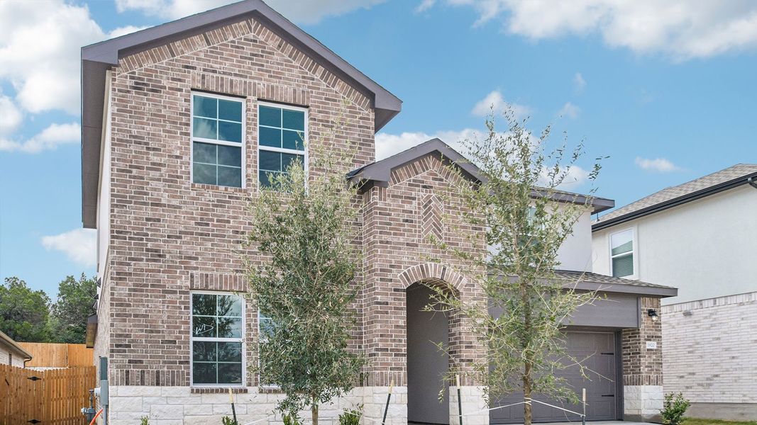 Front exterior of a new home in Rosenbusch Ranch, Leander, TX, highlighting curb appeal (Image 2).