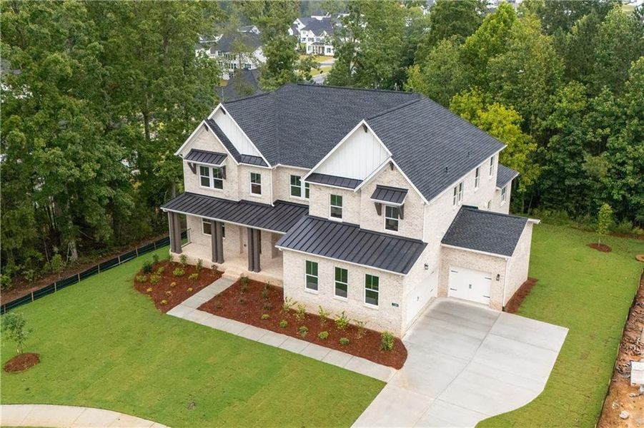 Front exterior of a new home in , Cumming, GA, highlighting curb appeal (Image 1).