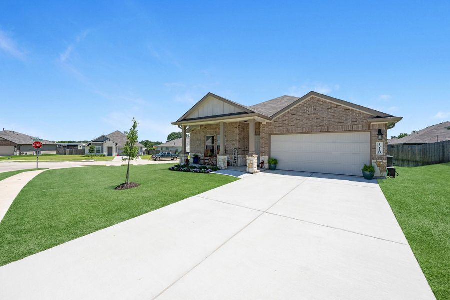 Front exterior of a new home in Liberty Village, Brenham, TX, highlighting curb appeal (Image 20).