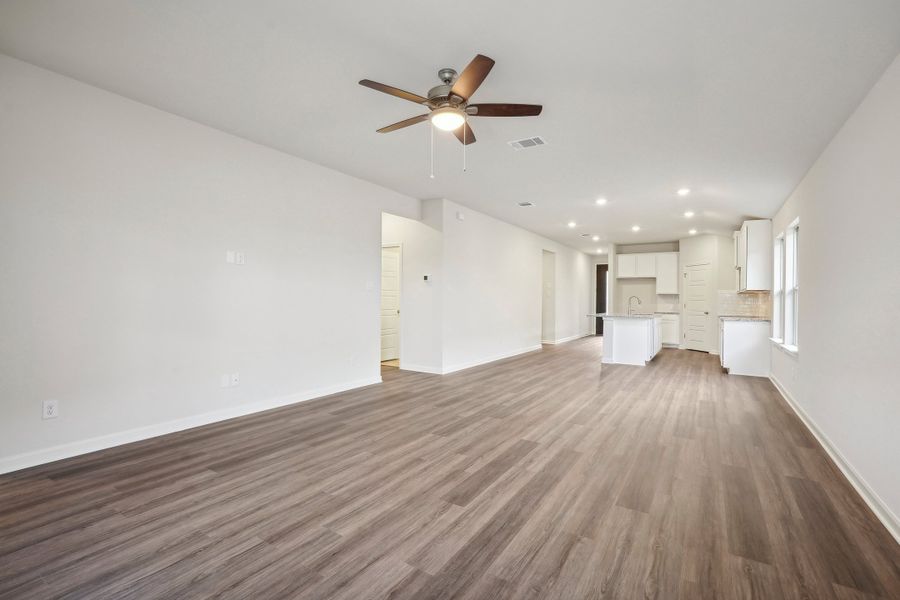 Living room, dining room, and kitchen in the Allen floorplan at a Meritage Homes community.