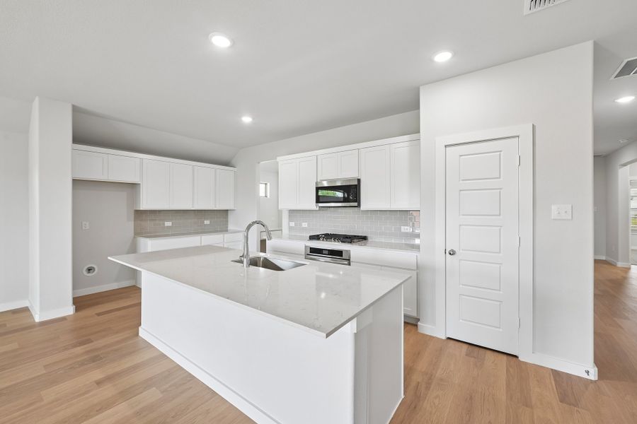 Kitchen in the Heisman home plan by Trophy Signature Homes Kitchen in the Heisman home plan by Trophy Signature Homes