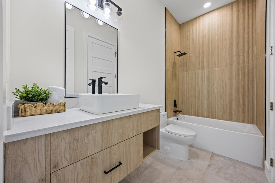 Full bath with vanity, shower / washtub combination, and recessed lighting