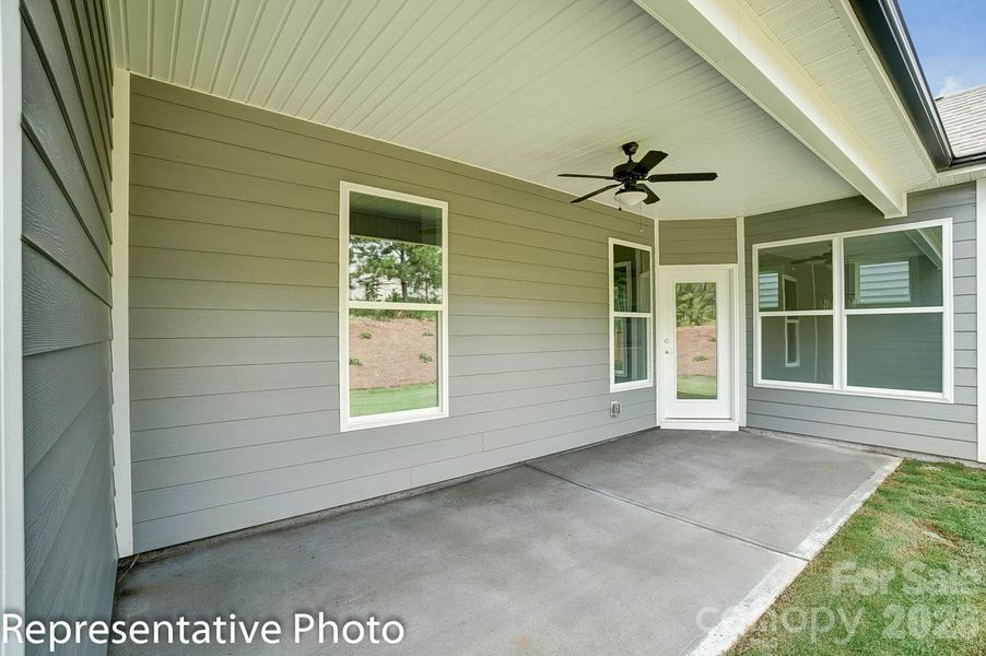 Covered porch at rear of home Covered porch at rear of home
