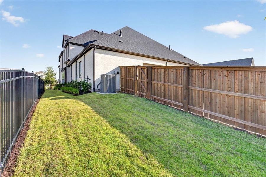 One more view. Gate leads to driveway. Privacy fencing to the back alley. One more view. Gate leads to driveway. Privacy fencing to the back alley.