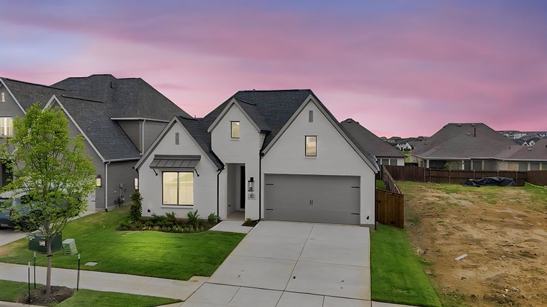 Front exterior of a new home in Tavolo Park, Fort Worth, TX, highlighting curb appeal (Image 24).