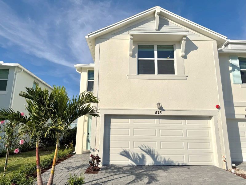 Front exterior of a new home in Tidewater, Fort Pierce, FL, highlighting curb appeal (Image 2). Front exterior of a new home in Tidewater, Fort Pierce, FL, highlighting curb appeal (Image 2).