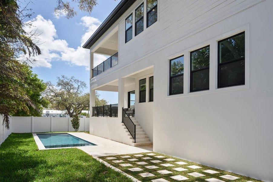 Exterior details and patio area of a home in City Homes - South Tampa, Tampa (Image 15).