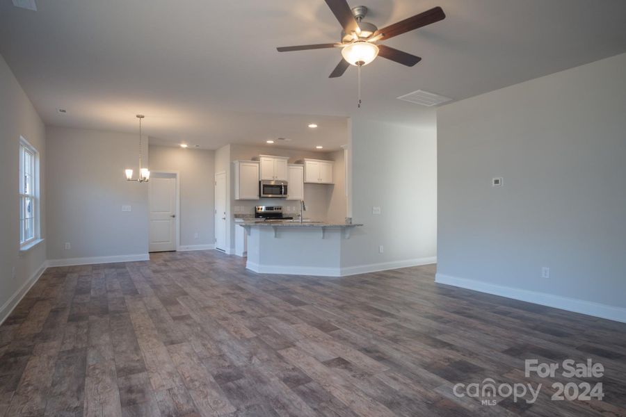 Family Room into Kitchen. Representative Photograph - Colors/Options may vary.