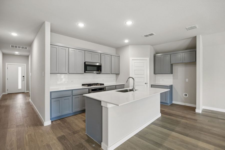 Kitchen in the Emmy II home plan by Trophy Signature Homes - REPRESENTATIVE PHOTO