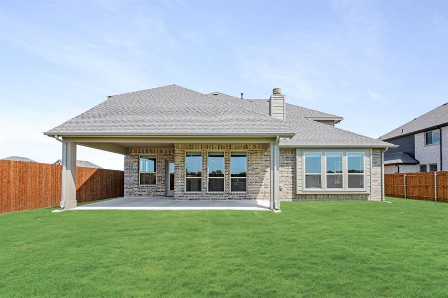 Front exterior of a new home in Timberbrook 3B-4A, Justin, TX, highlighting curb appeal (Image 1).