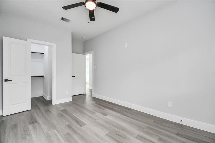 Secondary bedroom with walk in closet