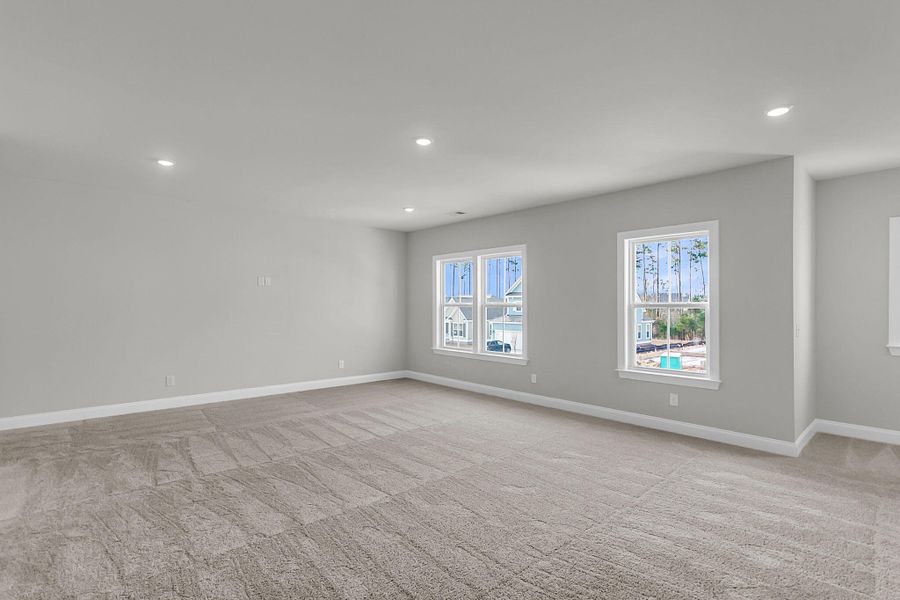 Spacious, unfurnished interior of a new home in Tidewater at Lakes of Cane Bay, Summerville (Image 57).