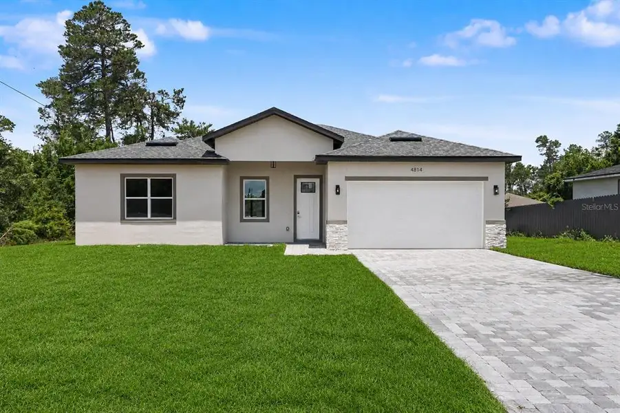 Front exterior of a new home in , Ocala, FL, highlighting curb appeal (Image 26).