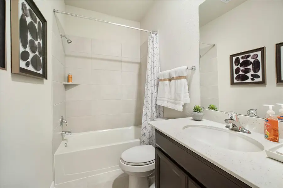 Sample photo of completed home with similar floor plan. As-built color and selections may vary.