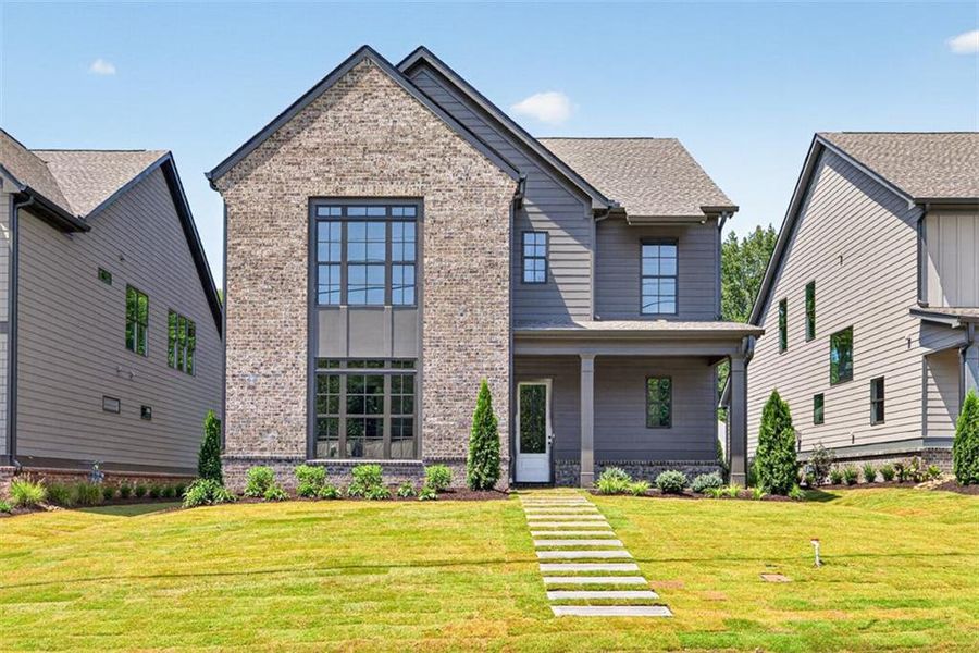 Front exterior of a new home in , Flowery Branch, GA, highlighting curb appeal (Image 34). Front exterior of a new home in , Flowery Branch, GA, highlighting curb appeal (Image 34).
