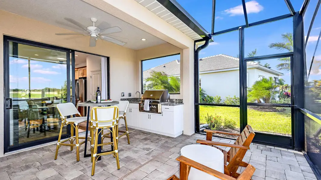 Exterior details and patio area of a home in SkySail Real Estate and Homes for Sale in Naples, FL - Neal Communities, Naples (Image 2). Exterior details and patio area of a home in SkySail Real Estate and Homes for Sale in Naples, FL - Neal Communities, Naples (Image 2).