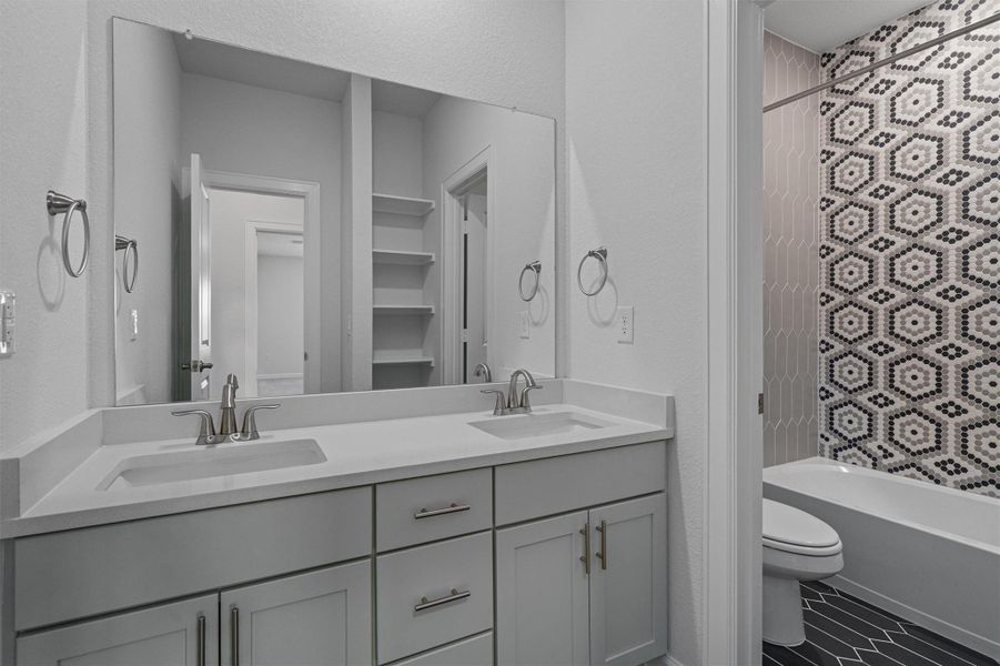 Full bath featuring double vanity and bathtub / shower combination Full bath featuring double vanity and bathtub / shower combination