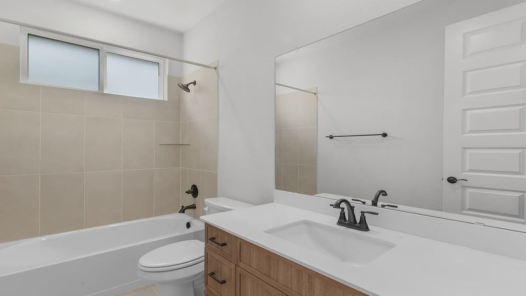 Representative furnished interior of a home built from the Mariah by Chesmar Homes in Newhaven, Manor (Image 3).