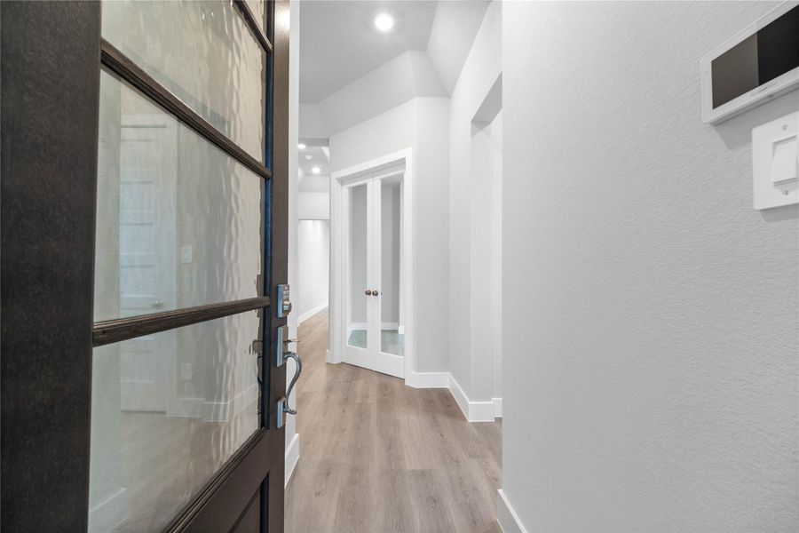 The entryway area is bright and modern, offering a welcoming first impression with clean lines and stylish finishes.