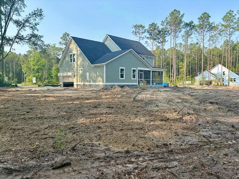 Front exterior of a new home in , Awendaw, SC, highlighting curb appeal (Image 23). Front exterior of a new home in , Awendaw, SC, highlighting curb appeal (Image 23).