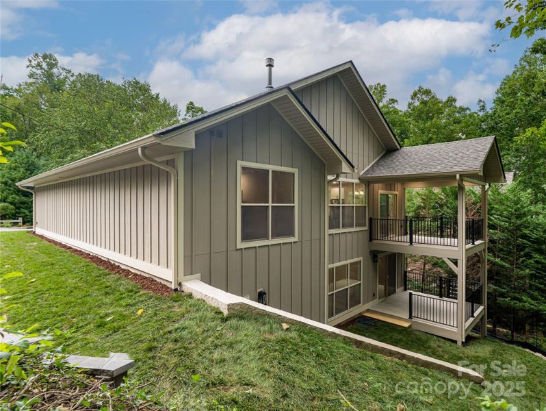 Front exterior of a new home in , Hendersonville, NC, highlighting curb appeal (Image 1).