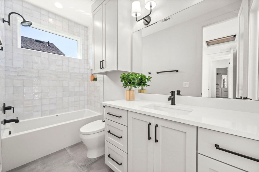 Bathroom with vanity and shower / bathtub combination