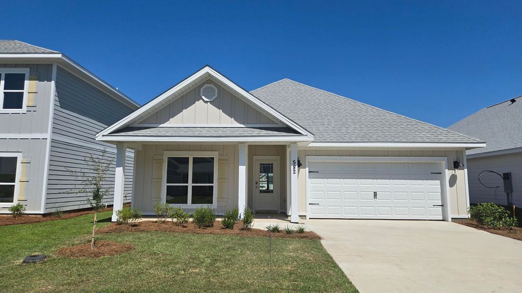 Front exterior of a new home in Bayside at Ward Creek, Panama City Beach, FL, highlighting curb appeal (Image 1). Front exterior of a new home in Bayside at Ward Creek, Panama City Beach, FL, highlighting curb appeal (Image 1).