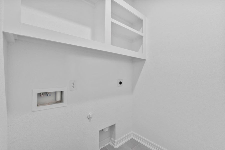 The utility room is designed for function, featuring durable finishes that keep up with daily life. The utility room is designed for function, featuring durable finishes that keep up with daily life.