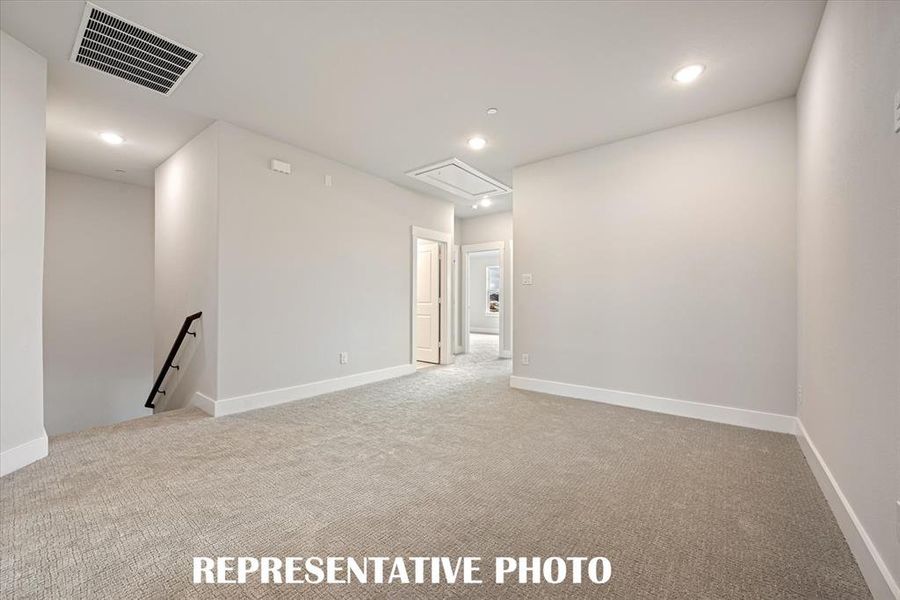 The upstairs game room provides a spacious second family living space. REPRESENTATIVE PHOTO The upstairs game room provides a spacious second family living space. REPRESENTATIVE PHOTO