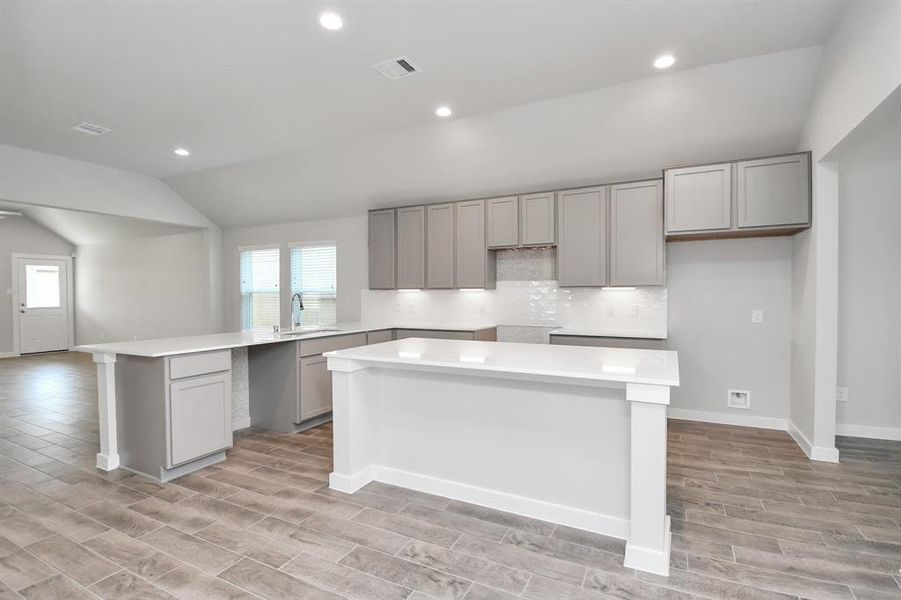 This generously spacious kitchen is a dream realized! Representation photo. Actual colors and selections may vary.