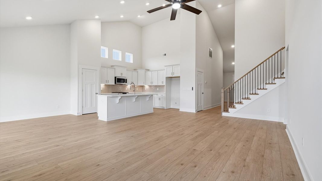 Hardwood flooring and high standards define this vibrant family room ideal for everyday living at the Iris Meadows community Hardwood flooring and high standards define this vibrant family room ideal for everyday living at the Iris Meadows community