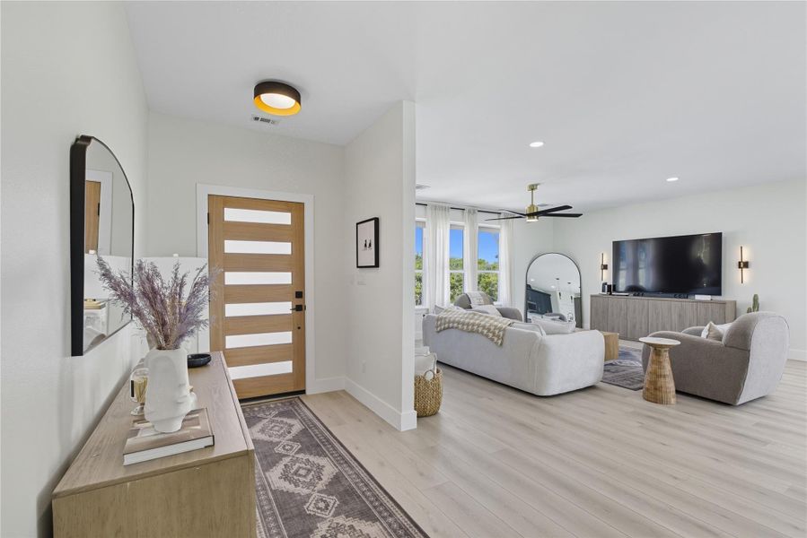 Entryway featuring light wood-style flooring, recessed lighting, and ceiling fan