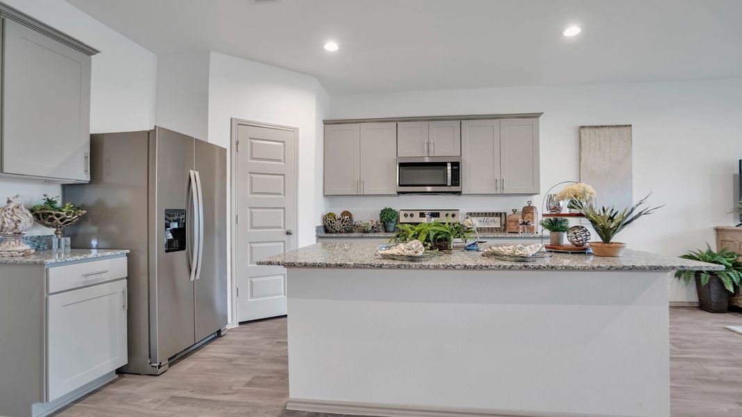 Representative furnished interior of a home built from the MITCHELL by D.R. Horton in Westward Pointe, Sealy (Image 6).
