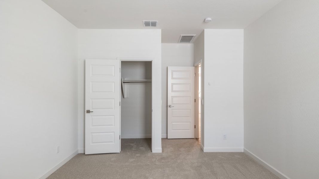 Spacious, unfurnished interior of a new home in Zanjero Pass, Waddell (Image 26).