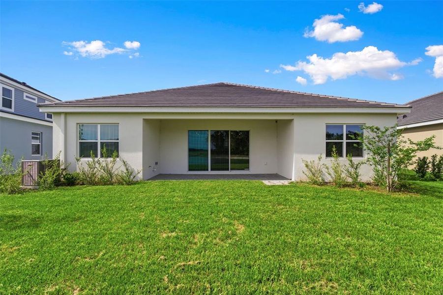 Exterior details and patio area of a home in Tamarack at Two Rivers, Zephyrhills (Image 3).
