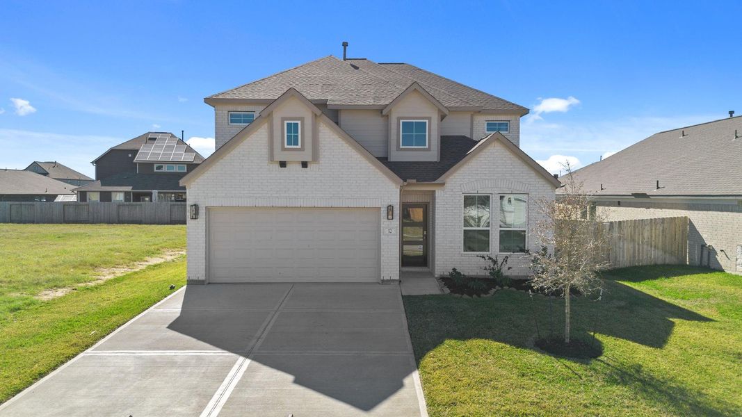 Front exterior of a new home in Beacon Hill, Waller, TX, highlighting curb appeal (Image 15).