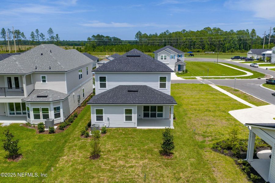 Front exterior of a new home in Beacon Lake, St. Augustine, FL, highlighting curb appeal (Image 40).