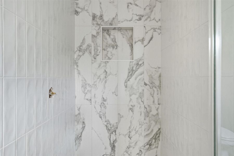 Bathroom view of a marble finish shower Bathroom view of a marble finish shower