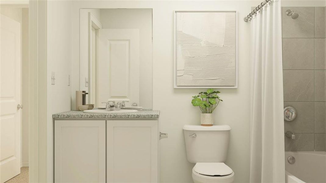 Full bathroom featuring shower / tub combo, vanity, and toilet