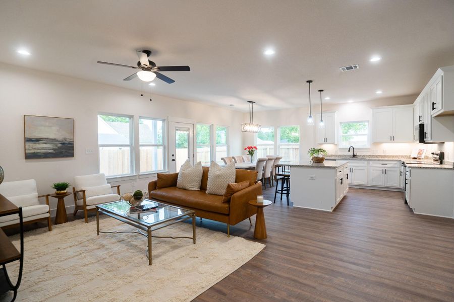 Living area featuring ceiling fan, dark wood finished floors, and recessed lighting