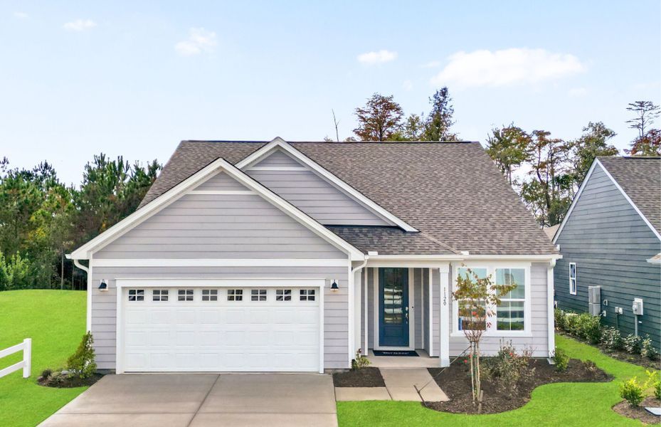 Front exterior of a new home in The Haven at Riverlights, Wilmington, NC, highlighting curb appeal (Image 1).