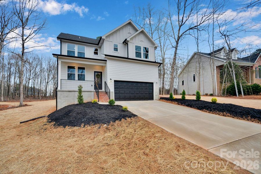 Front exterior of a new home in , Statesville, NC, highlighting curb appeal (Image 25).